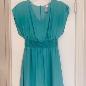 Turquoise dress with detailed waistline